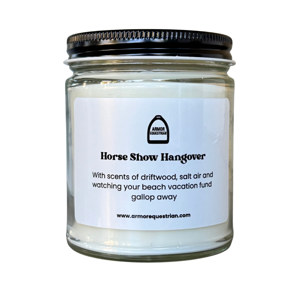Candle jar labeled 'Horse Show Hangover' with a black lid on a white background