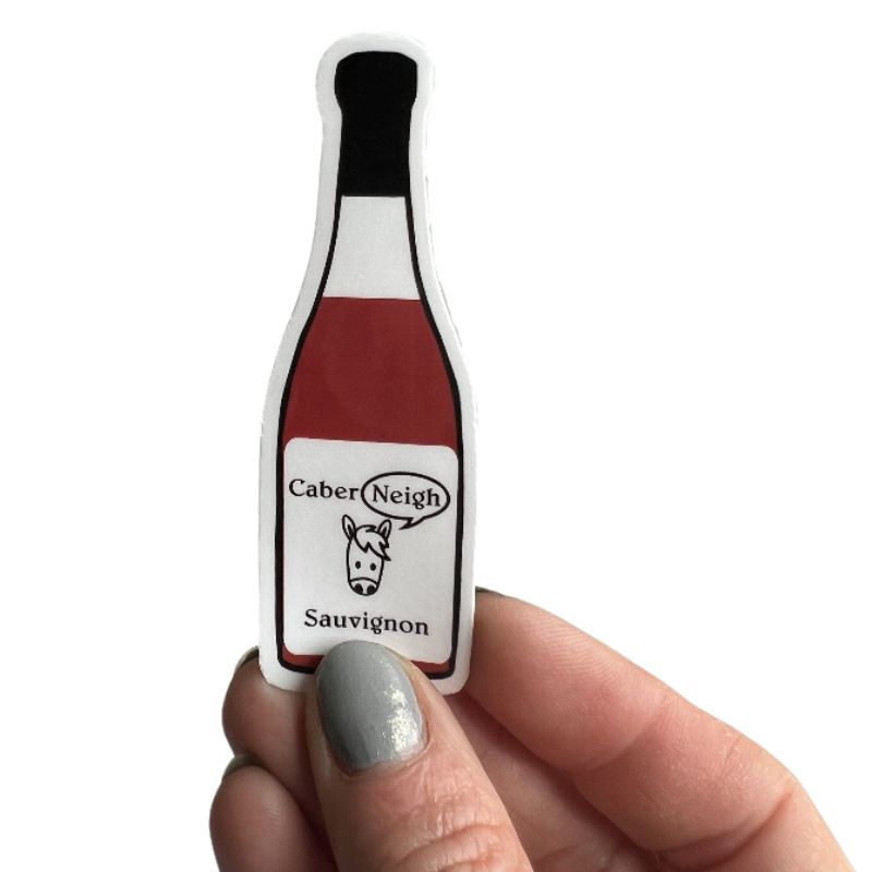 Caber-neigh horse wine sticker in hand