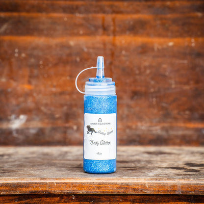 Blue and white bottle with pump on a wooden surface