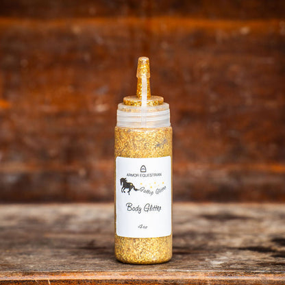 Gold-colored bottle with a label on a wooden surface