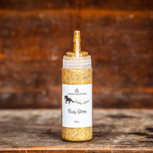 Gold-colored bottle with a label on a wooden surface