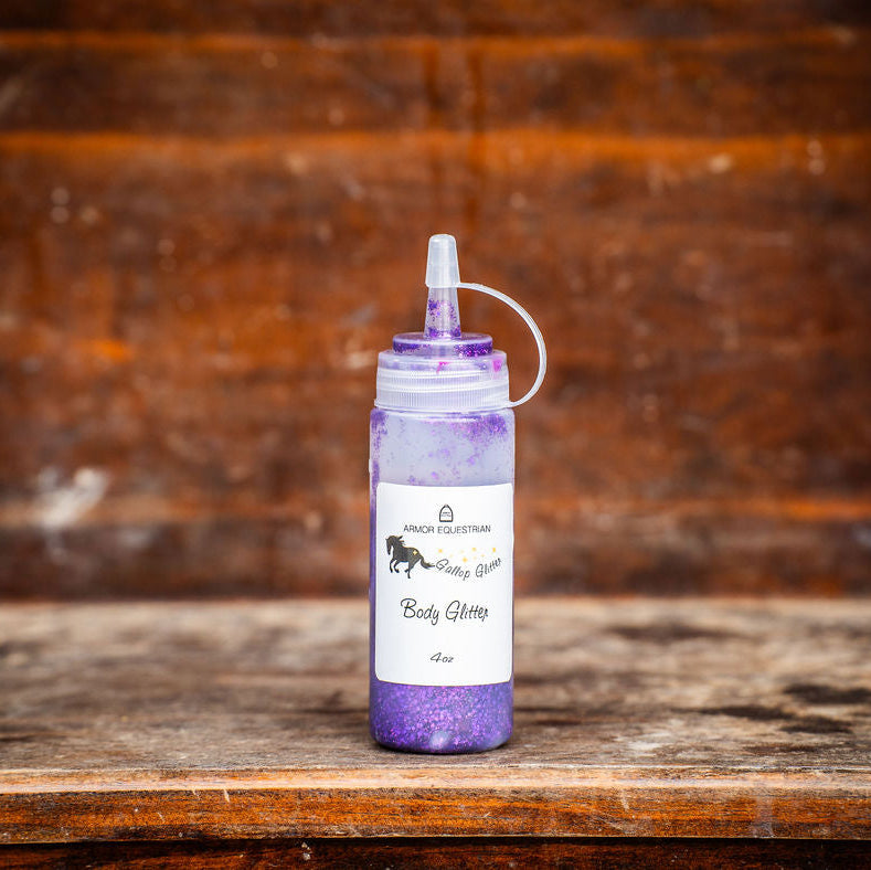 Purple bottle with white label on a wooden surface