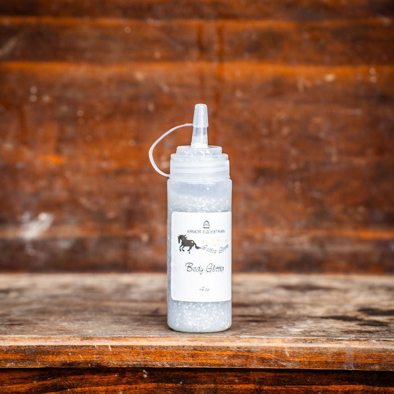 White bottle with a label on a wooden surface and background