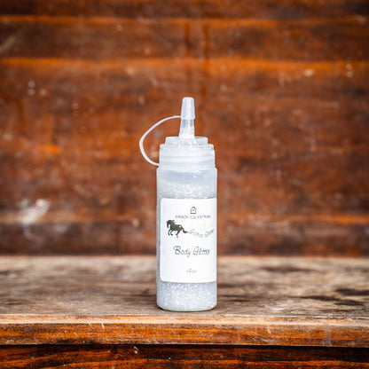 White bottle with a label on a wooden surface and background