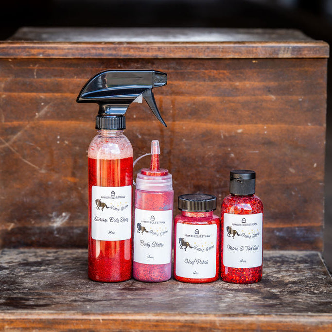 Set of red bottles with labels on a wooden surface