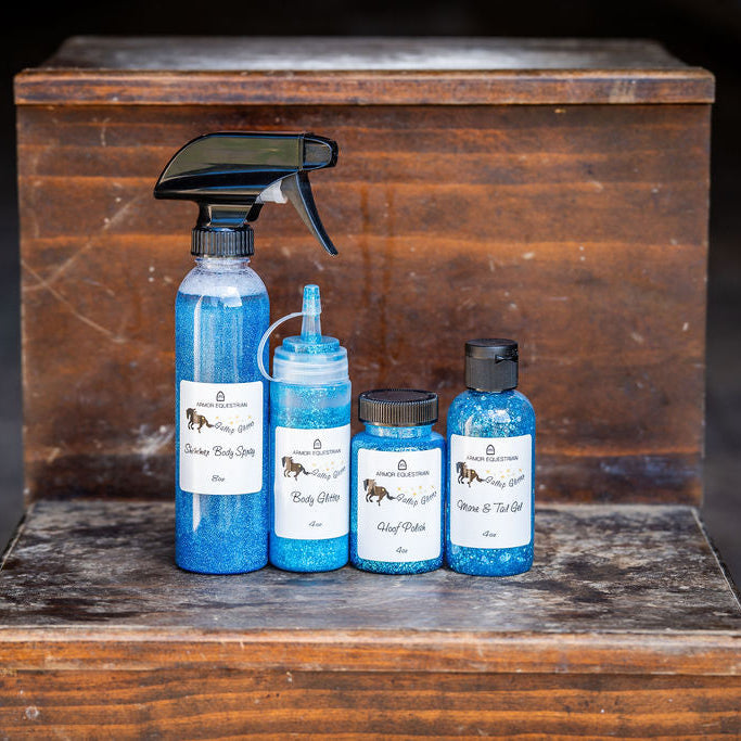 Set of blue bottles with labels on a wooden surface