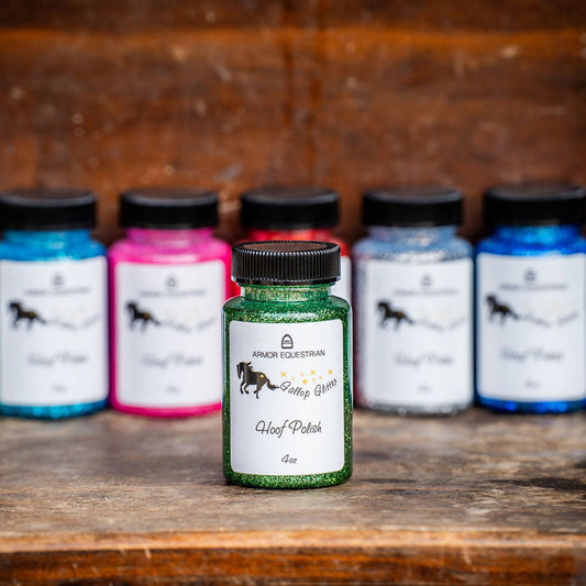 Assorted bottles of horse care products on a wooden surface