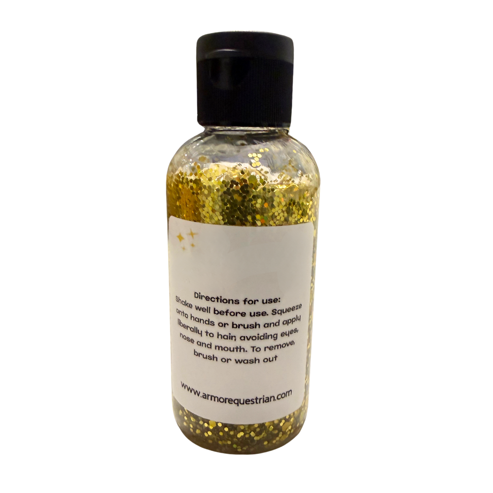 Bottle of gold glitter with a label on a white background