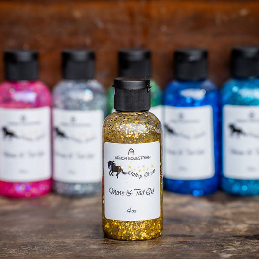 Collection of small bottles with colorful labels on a wooden surface