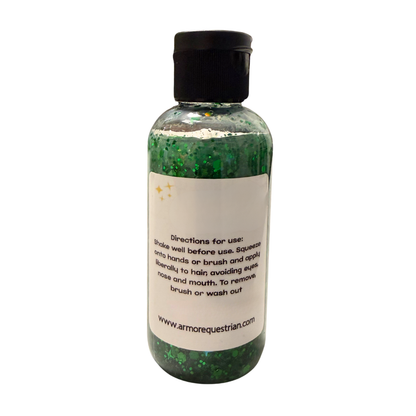 Bottle of green glittery product with a black cap on a white background