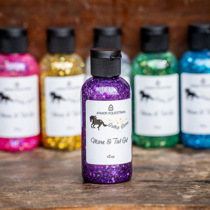 Colorful bottles of Mane & Tail Gel on a wooden surface with a blurred background