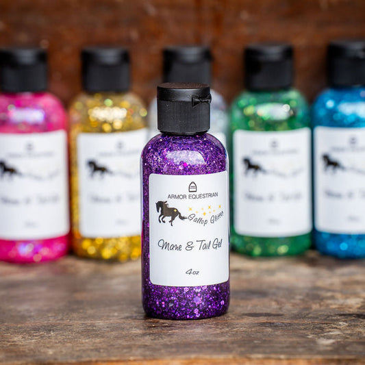 Colorful bottles of Mane & Tail Gel on a wooden surface with a blurred background
