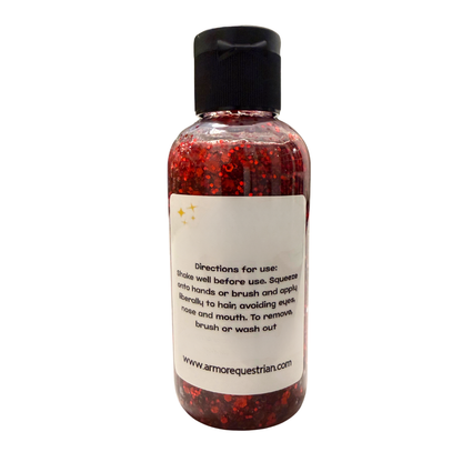 Bottle of red glittery product with a black cap on a white background