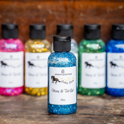 Assorted bottles of Spankh Equestrian mane and tail gel on a wooden surface.
