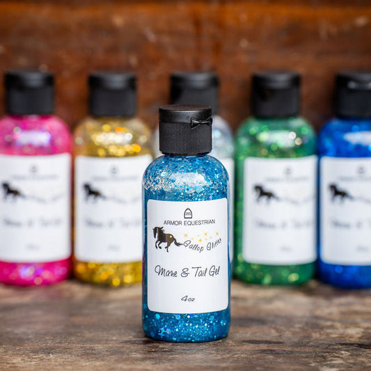 Assorted bottles of Spankh Equestrian mane and tail gel on a wooden surface.