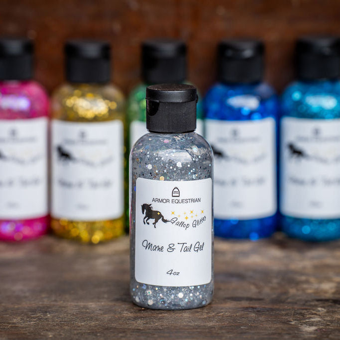 Collection of small bottles with labels on a wooden surface