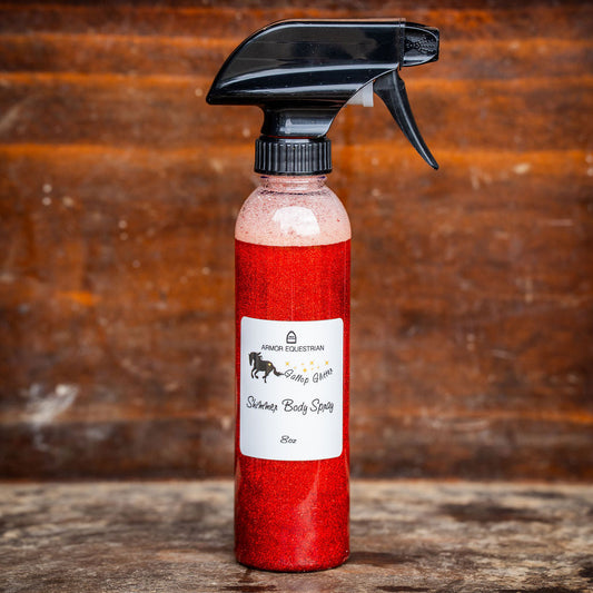 Red spray bottle with black nozzle on a wooden surface