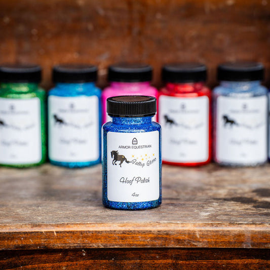 Assorted ink bottles on a wooden surface with a rustic background