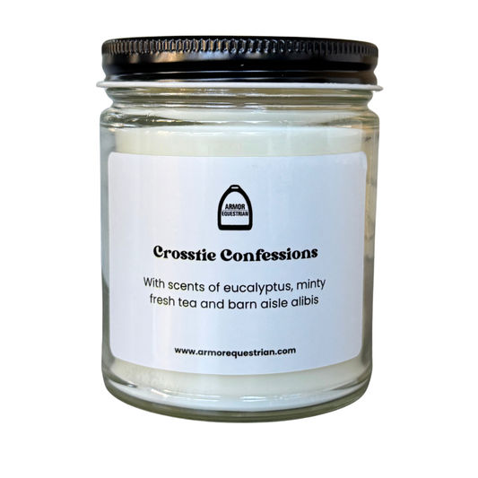 Candle jar labeled 'Crosstie Confessions' with a black lid on a white background