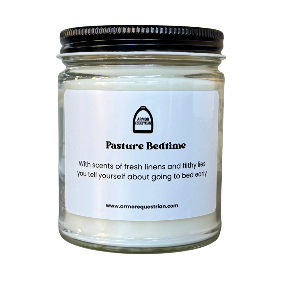 Candle jar labeled 'Pasture Bedtime' with a black lid on a white background