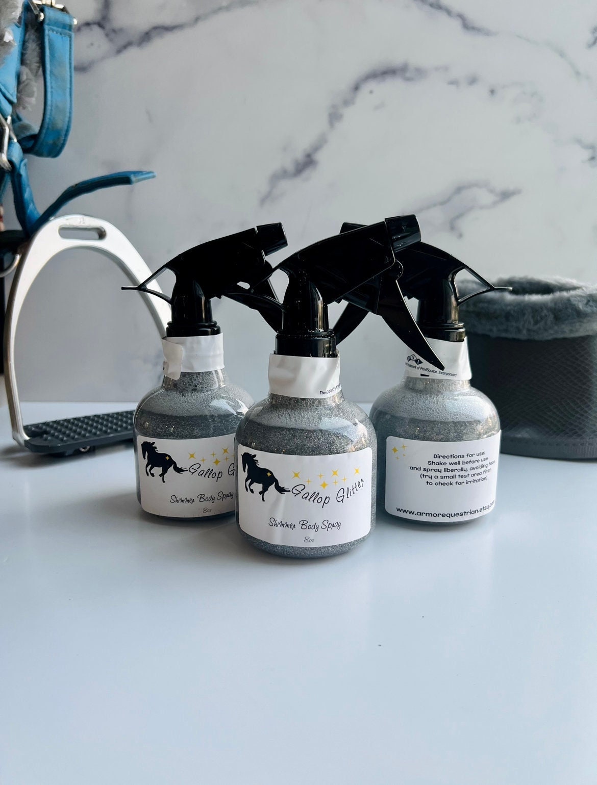 3 bottles of Gallop Glitter Silver Shimmer Body Spray on backdrop